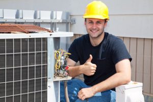 HVAC worker wearing hard hat with his thumbs up